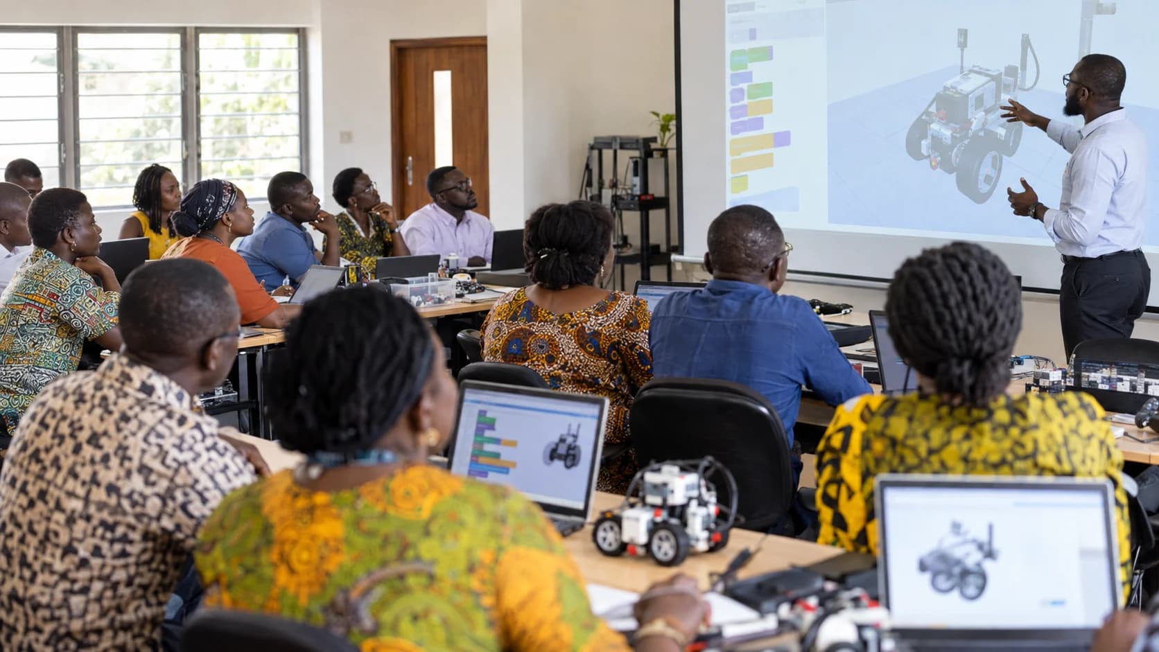 Ghanaian teachers participating in a practical robotics and coding workshop